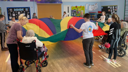 Care home residents with pupils at Longlands Primary School, Market Drayton