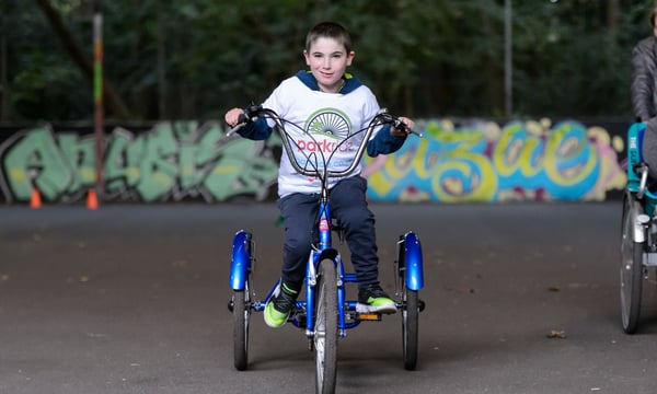 A child cycling outdoors